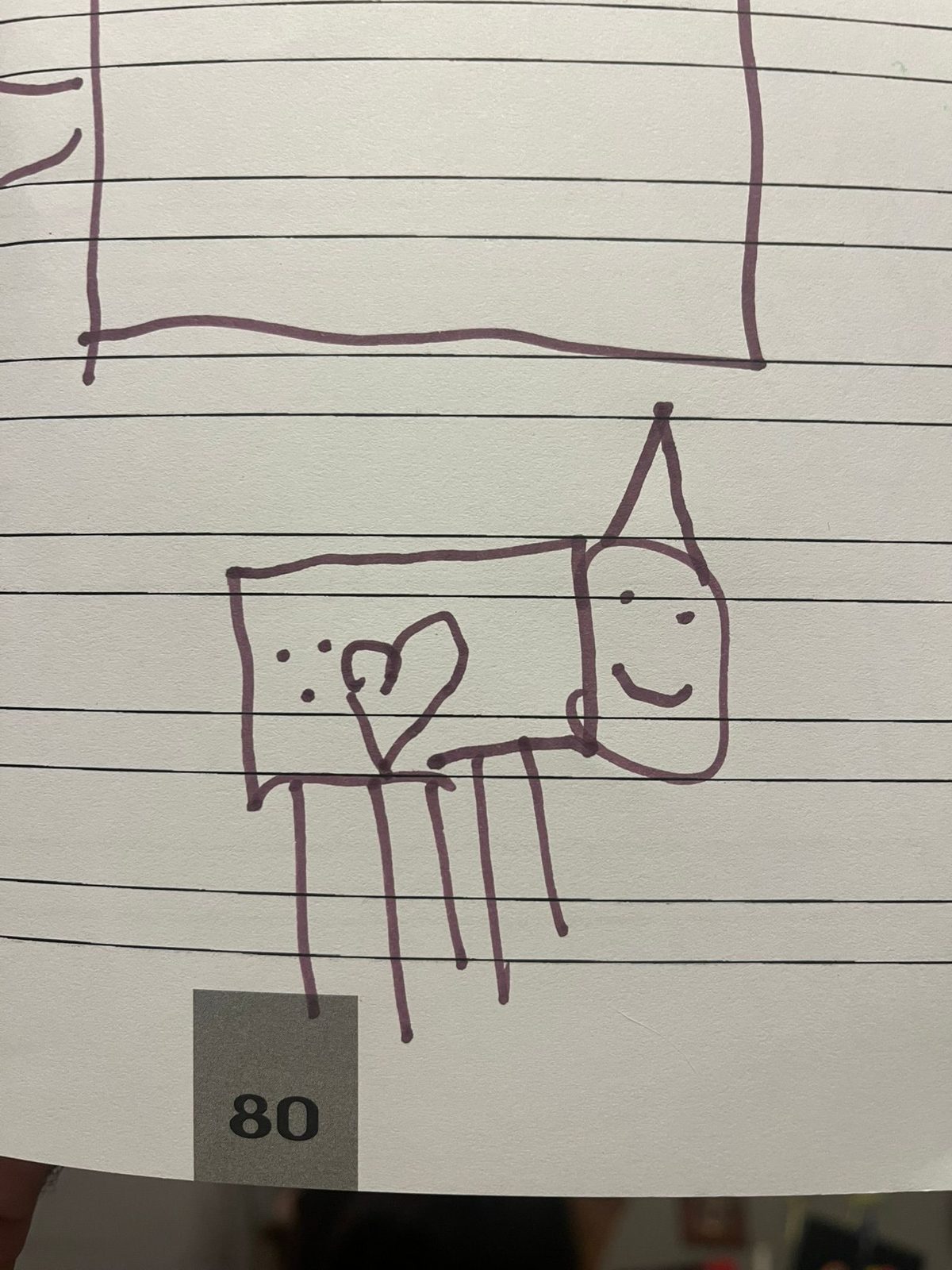 Original drawing on lined paper: five-legged creature with a heart on its rectangular body